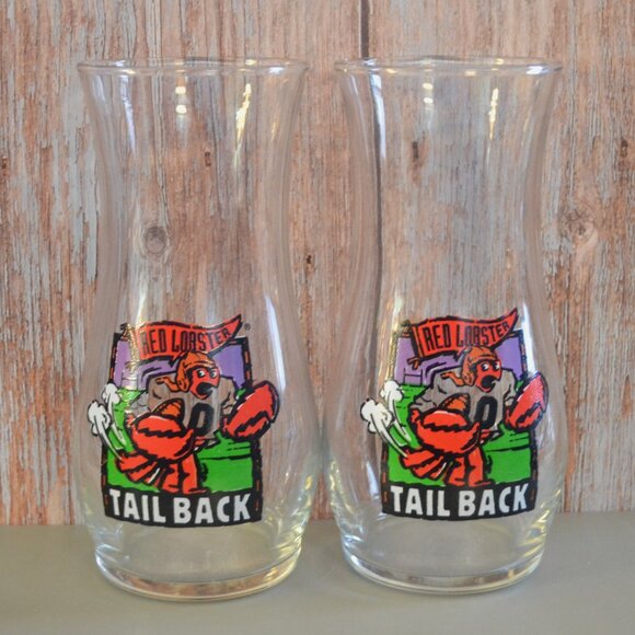 Pair Of Vintage Red Lobster Tailback Hurricane Pilsner Beer Glasses Football - Picture 1 of 5